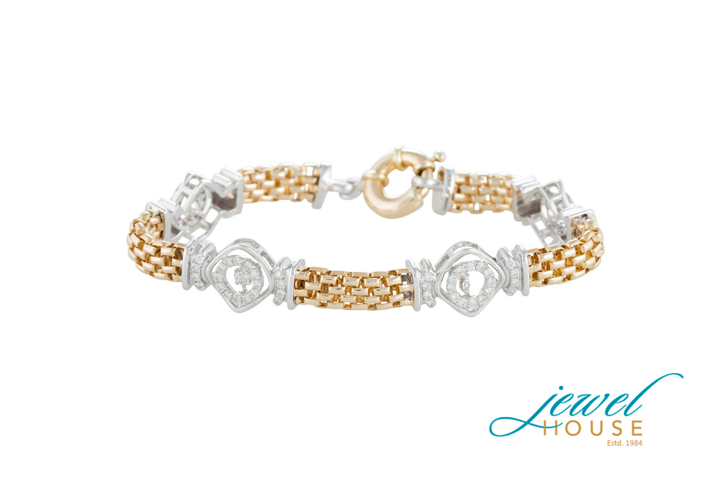 DANCING DIAMOND STATION BRACELET IN 14KT YELOW AND WHITE GOLD