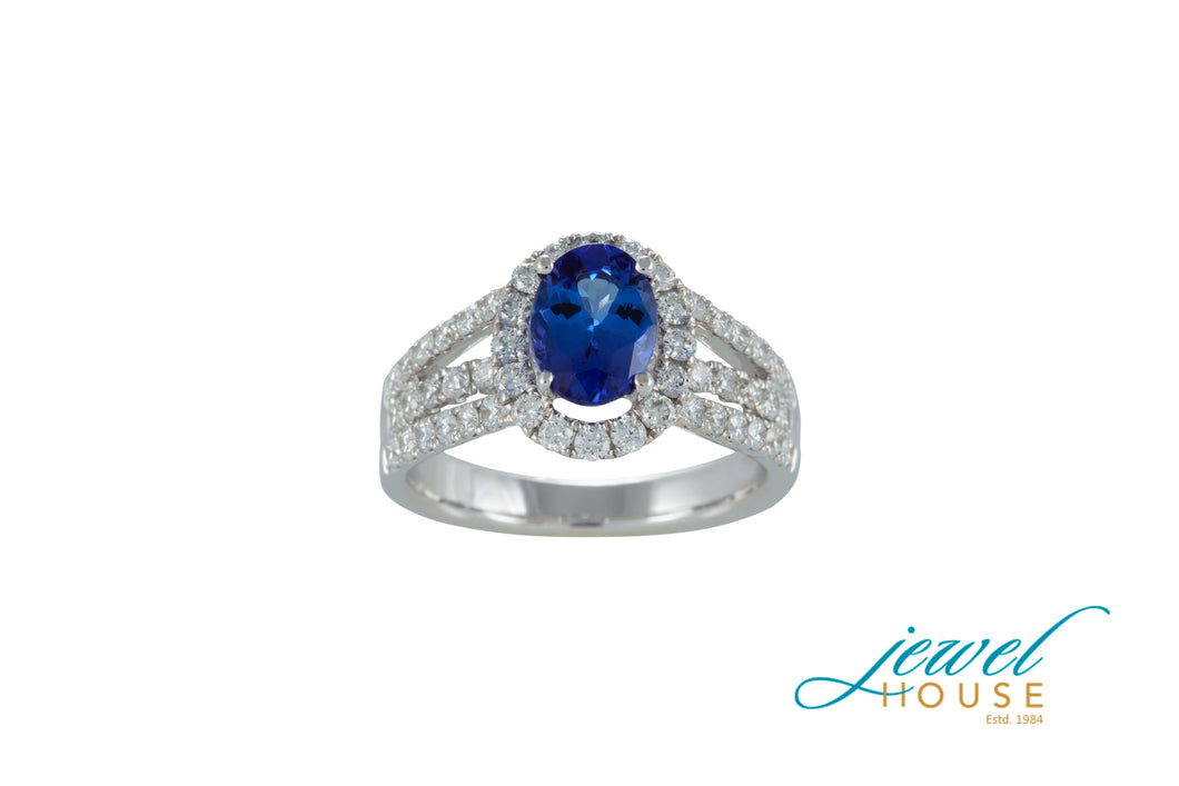 OVAL TANZANITE AND DIAMOND HALO SPLIT SHANK THREE ROW RING IN 18KT WHITE GOLD
