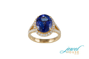 OVAL TANZANITE AND DIAMOND HALO SPLIT SHANK RING IN 18KT YELLOW GOLD