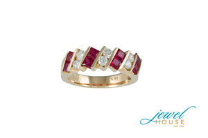 CROSSWAY BAR PRINESS RUBIES AND ROUND DIAMOND RING IN 14KT YELLOW GOLD