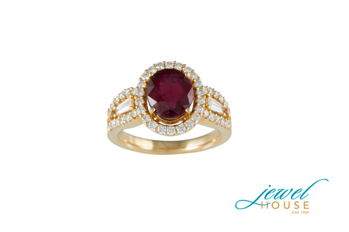 OVAL RUBY WITH ROUND DIAMOND HALO BAGUETTE RING IN 18KT GOLD